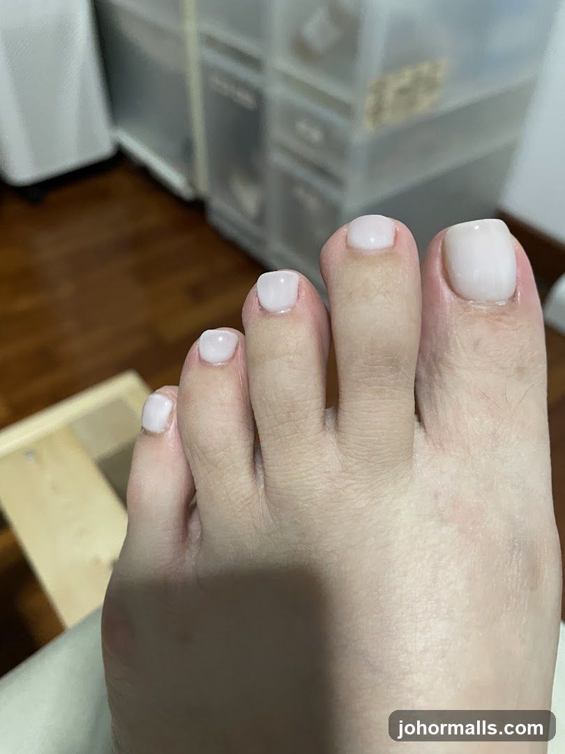 Toes with White Nail Polish