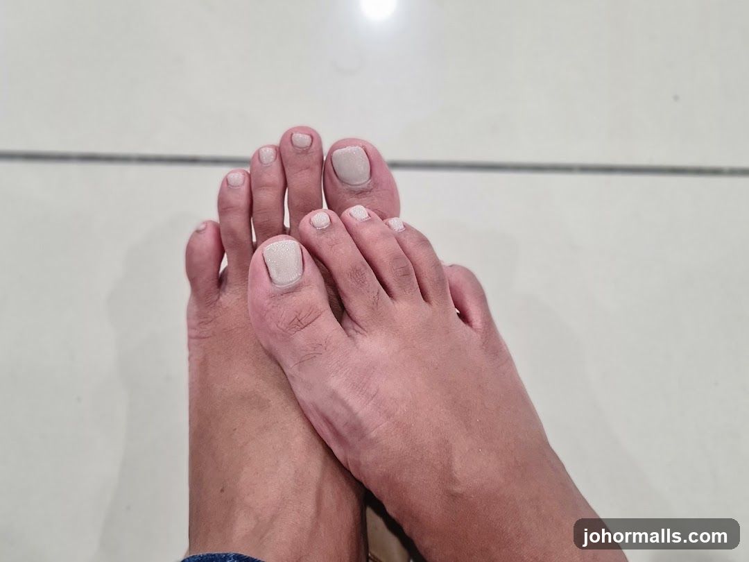 Toes with light-colored nail polish