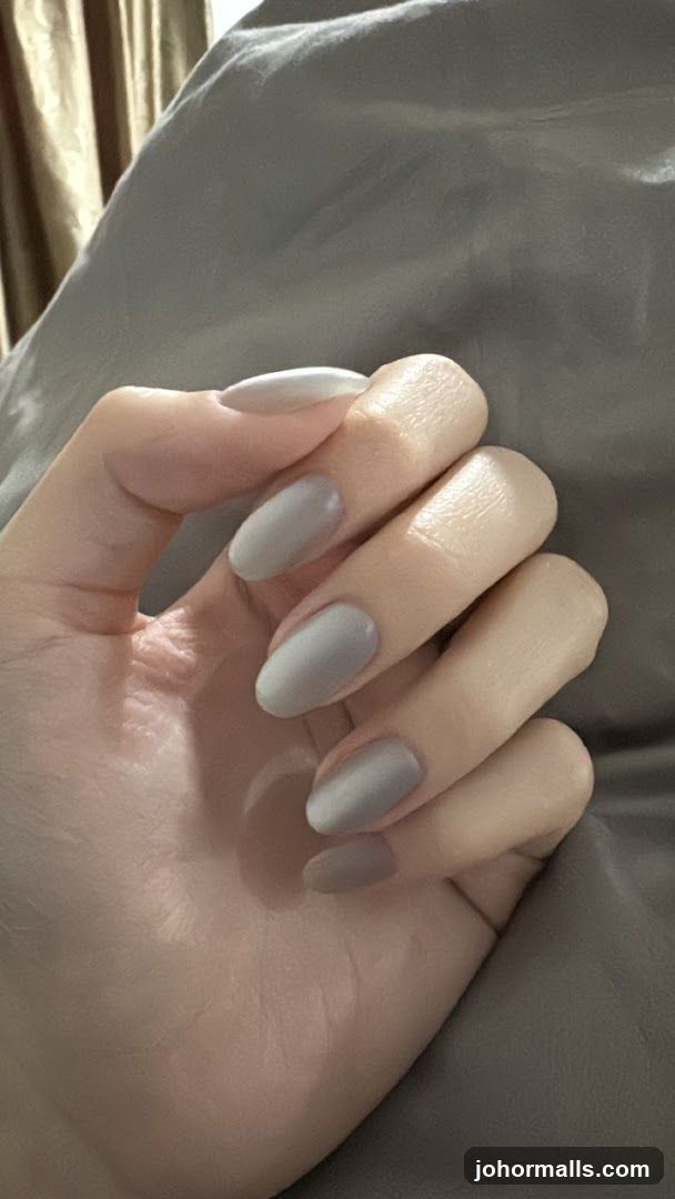 Hand with Grey Nails