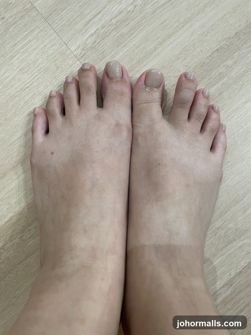 Toes with light brown nail polish