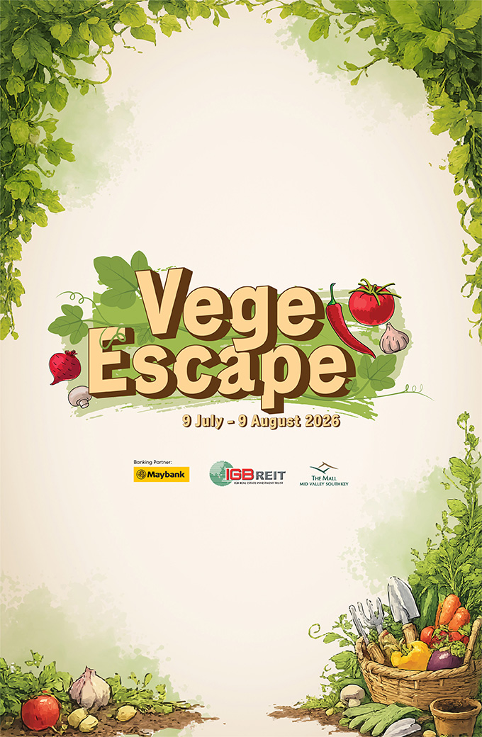 Vege Escape gift with purchase display at Mid Valley Southkey showing Maybank cardholder rewards and vegetable-themed merchandise